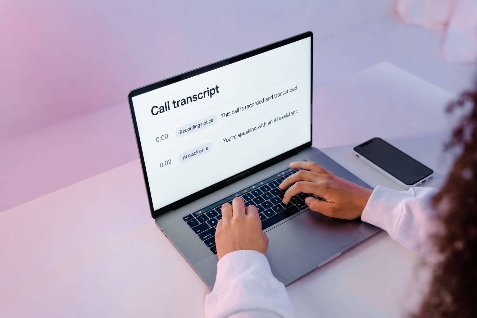 A call transcript on a laptop showing the recording notice and the AI disclosure as two separate lines at the start of the call