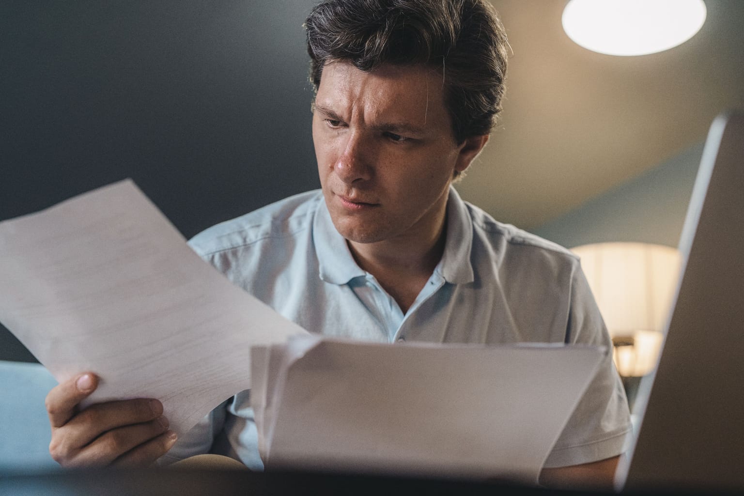 How much does an answering service cost: a business owner frowning at a monthly bill