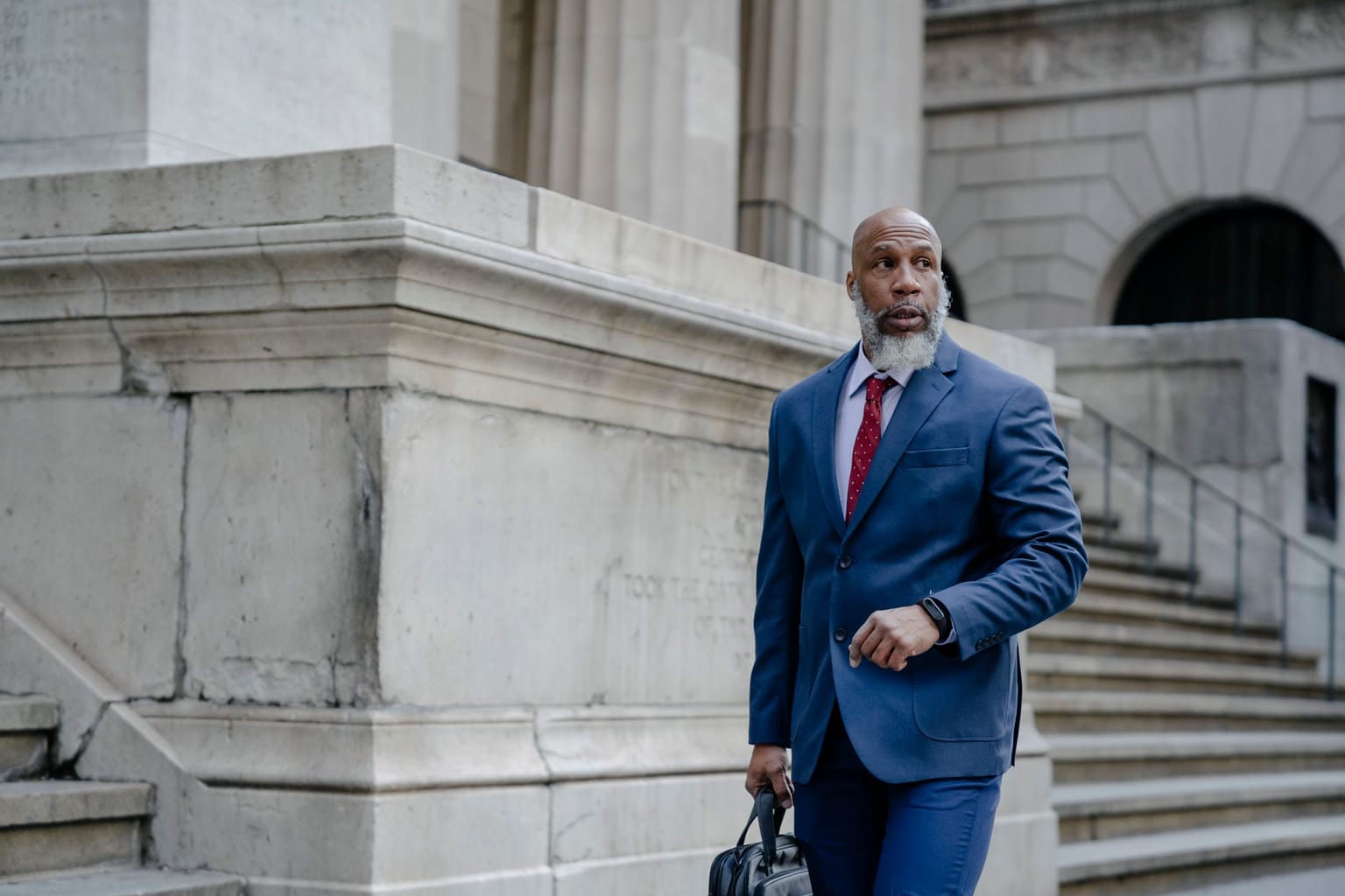 Law firm missed calls: an attorney walking out of a courthouse with his briefcase