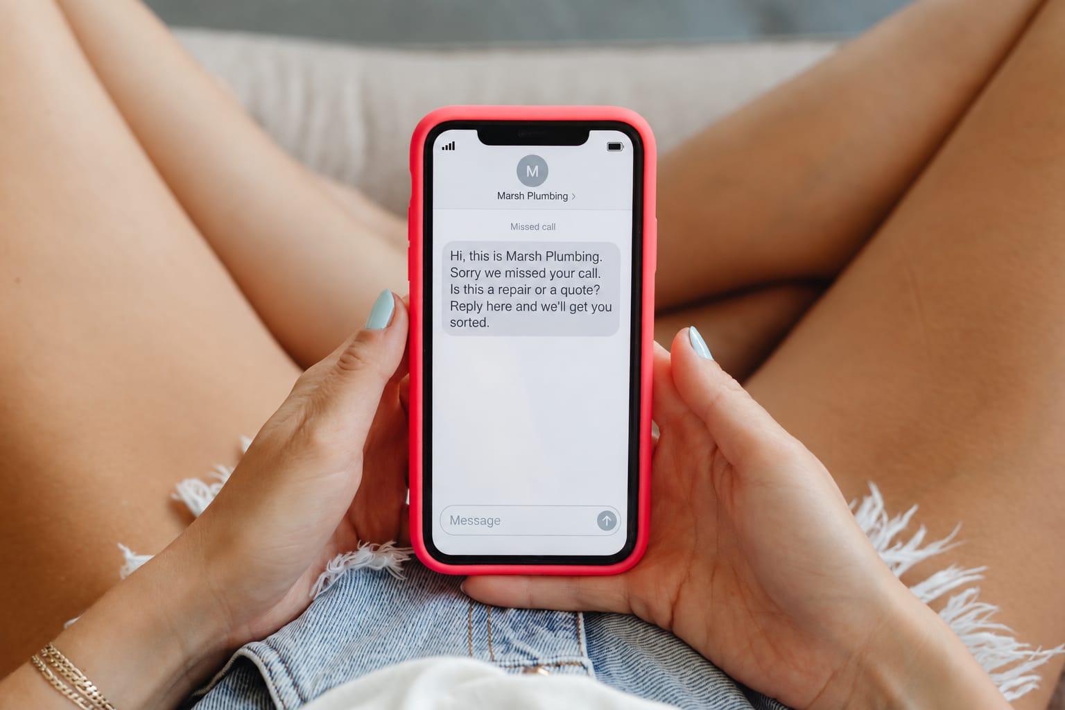 Missed call text back message arriving on a phone: a text from a plumbing business right after a missed call